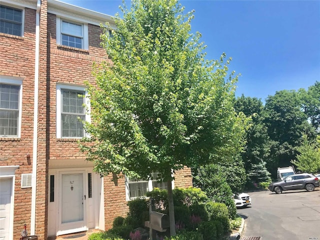 87 Marjorie Ct, Manhasset, NY 11030 - view of front of house with brick siding