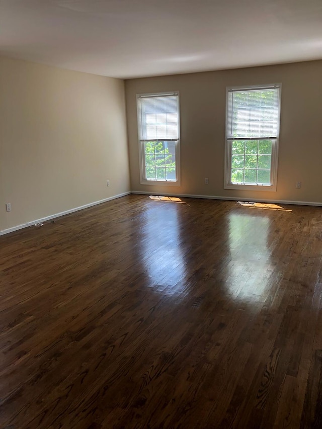 87 Marjorie Ct, Manhasset, NY 11030 - unfurnished room featuring dark wood-type flooring and plenty of natural light