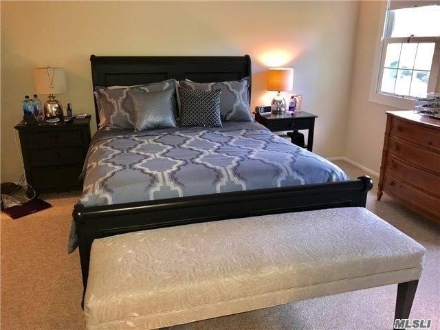 87 Marjorie Ct, Manhasset, NY 11030 - bedroom with carpet flooring and baseboards