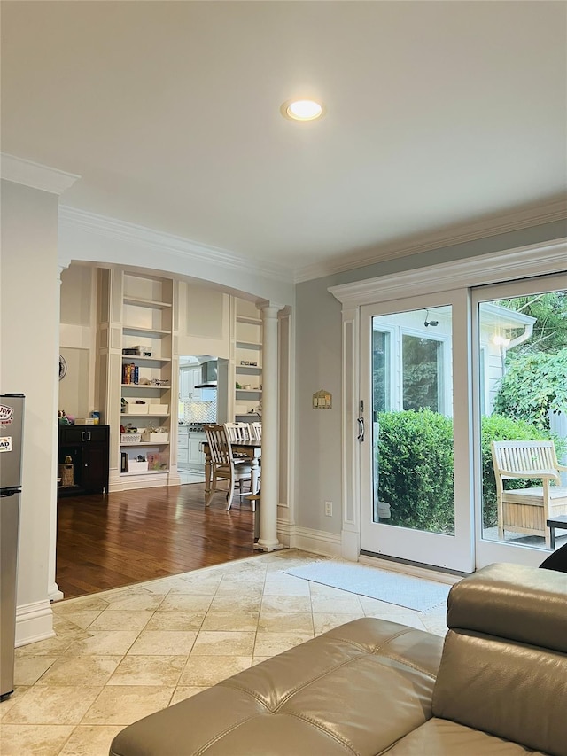 18 Sherwood Ln, Roslyn Heights, NY 11577 - entryway with crown molding, ornate columns, and recessed lighting