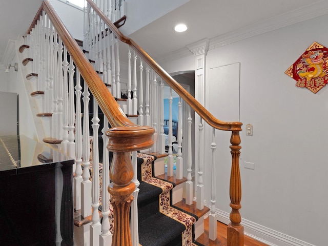 18 Sherwood Ln, Roslyn Heights, NY 11577 - stairs featuring crown molding, wood finished floors, and recessed lighting