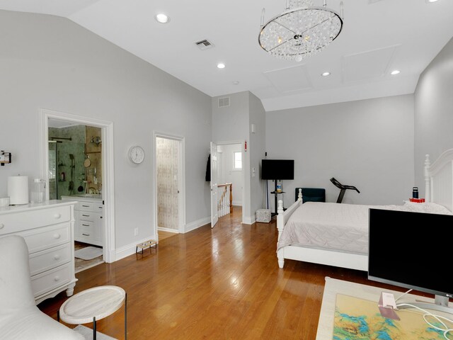 18 Sherwood Ln, Roslyn Heights, NY 11577 - bedroom featuring lofted ceiling, attic access, wood finished floors, and recessed lighting
