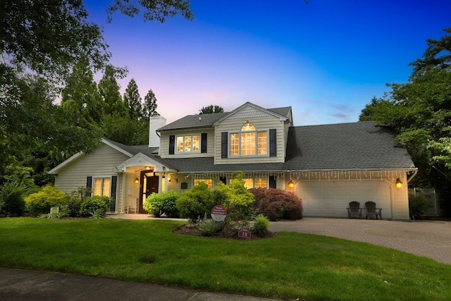 18 Sherwood Ln, Roslyn Heights, NY 11577 - traditional-style house featuring a garage, a lawn, driveway, a chimney, and roof with shingles