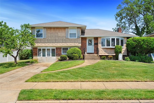 17 Damin Dr S, Farmingdale, NY 11735 - split level home with a chimney and roof with shingles