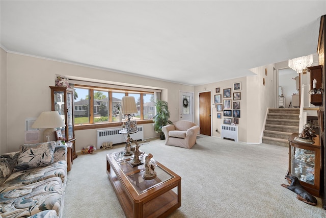 17 Damin Dr S, Farmingdale, NY 11735 - living area featuring radiator heating unit, carpet, and stairway