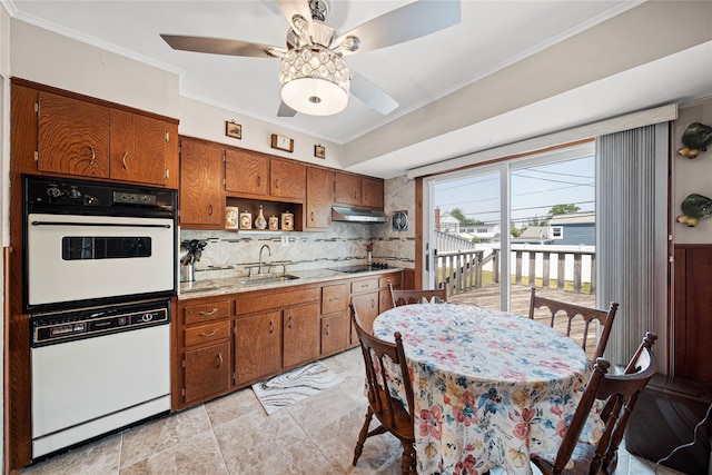 17 Damin Dr S, Farmingdale, NY 11735 - kitchen featuring white appliances, brown cabinetry, light countertops, backsplash, and ceiling fan