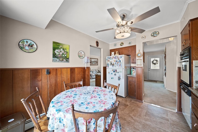 17 Damin Dr S, Farmingdale, NY 11735 - dining space with a ceiling fan, wainscoting, crown molding, and wooden walls