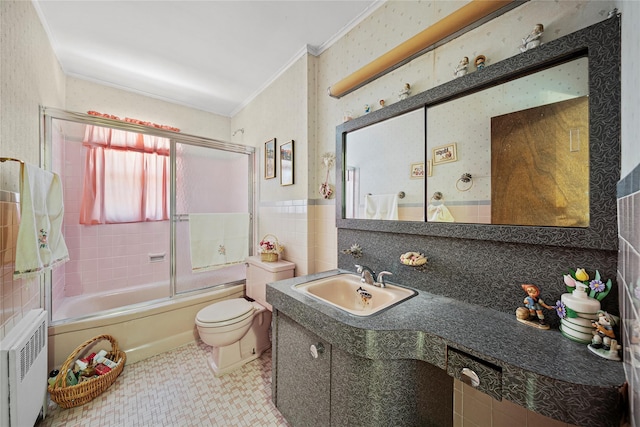 17 Damin Dr S, Farmingdale, NY 11735 - bathroom featuring radiator, ornamental molding, tile walls, vanity, and shower / bath combination with glass door