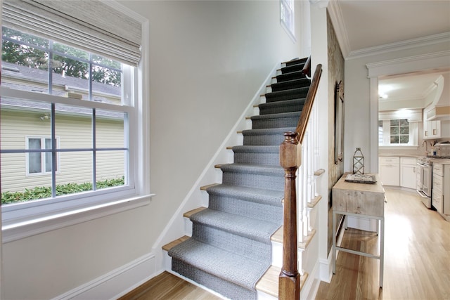 30 Prescott St, Garden City, NY 11530 - staircase featuring crown molding and wood finished floors