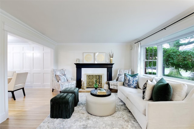 30 Prescott St, Garden City, NY 11530 - living area featuring wood finished floors, crown molding, and a fireplace