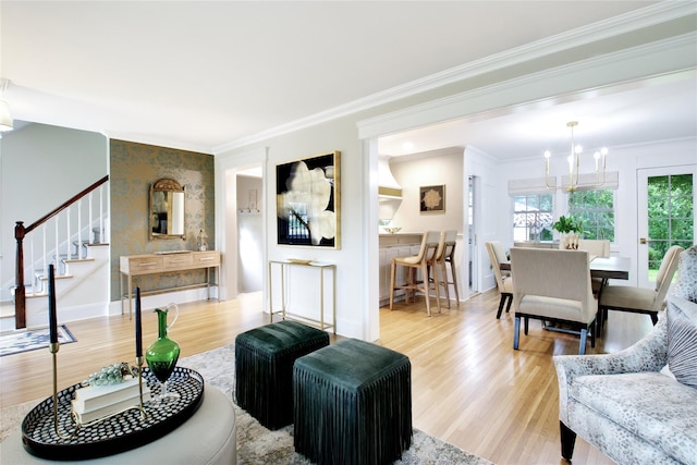 30 Prescott St, Garden City, NY 11530 - living room featuring wood finished floors, stairway, a chandelier, and ornamental molding
