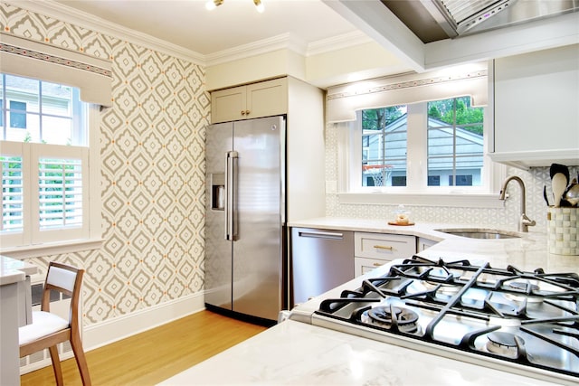 30 Prescott St, Garden City, NY 11530 - kitchen with high end fridge, wallpapered walls, light wood-style floors, ornamental molding, and radiator heating unit