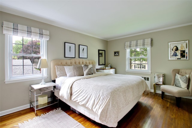 30 Prescott St, Garden City, NY 11530 - bedroom with wood finished floors, ornamental molding, and radiator heating unit