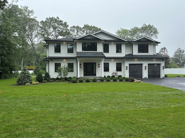 352 Cold Spring Rd, Syosset, NY 11791 - view of front of house featuring an attached garage, asphalt driveway, stucco siding, a standing seam roof, and a metal roof
