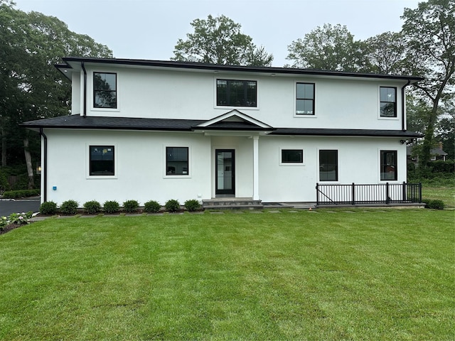 352 Cold Spring Rd, Syosset, NY 11791 - view of front facade with stucco siding and a front yard