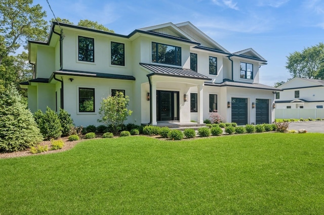 352 Cold Spring Rd, Syosset, NY 11791 - modern farmhouse featuring concrete driveway, an attached garage, a standing seam roof, and stucco siding