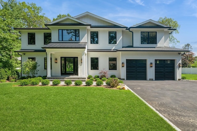 352 Cold Spring Rd, Syosset, NY 11791 - modern inspired farmhouse featuring asphalt driveway, a garage, stucco siding, and a front yard
