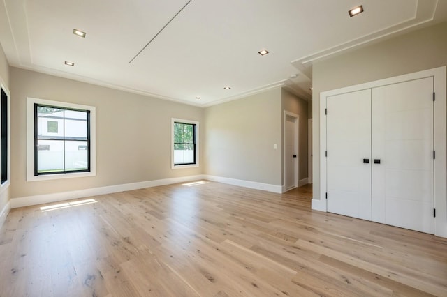 352 Cold Spring Rd, Syosset, NY 11791 - unfurnished bedroom with light wood-style flooring, a closet, crown molding, and recessed lighting