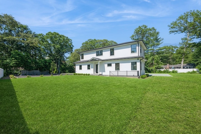 352 Cold Spring Rd, Syosset, NY 11791 - back of property with stucco siding and a lawn