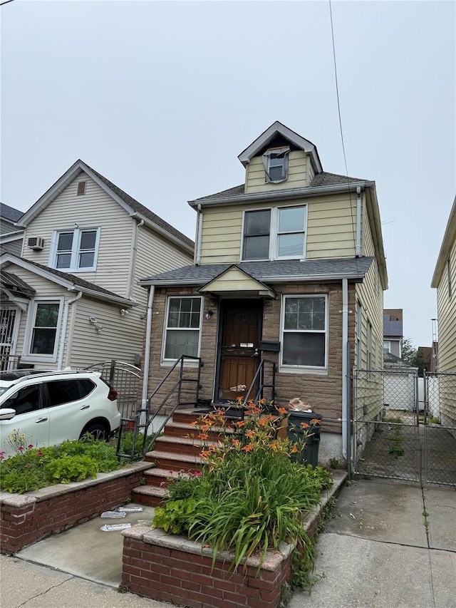 10521 84th St, Ozone Park, NY 11417 - view of front of property featuring a gate and roof with shingles