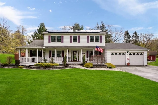 1 Cindy Ln, Highland Mills, NY 10930 - view of front facade with covered porch, an attached garage, driveway, and a front yard
