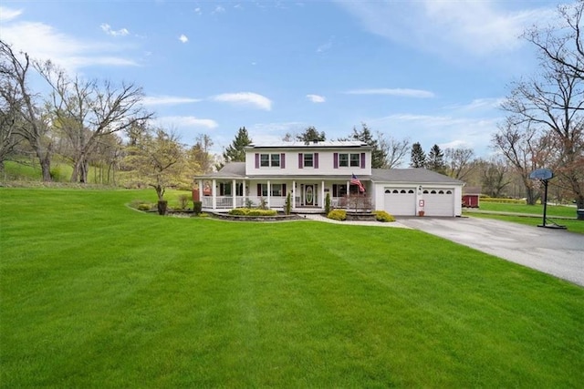 1 Cindy Ln, Highland Mills, NY 10930 - view of front facade with a porch, an attached garage, driveway, and a front yard