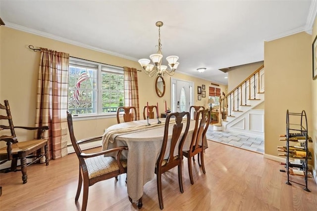 1 Cindy Ln, Highland Mills, NY 10930 - dining room with a chandelier, light wood finished floors, crown molding, stairs, and a baseboard heating unit