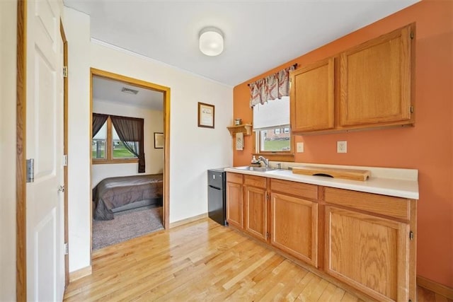 1 Cindy Ln, Highland Mills, NY 10930 - kitchen with light wood-style floors, light countertops, and brown cabinets