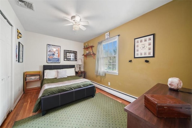 1 Cindy Ln, Highland Mills, NY 10930 - bedroom with a baseboard radiator, wood finished floors, a closet, and a ceiling fan