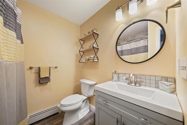 1 Cindy Ln, Highland Mills, NY 10930 - full bathroom featuring a baseboard heating unit, wood finished floors, vanity, decorative backsplash, and a shower with curtain