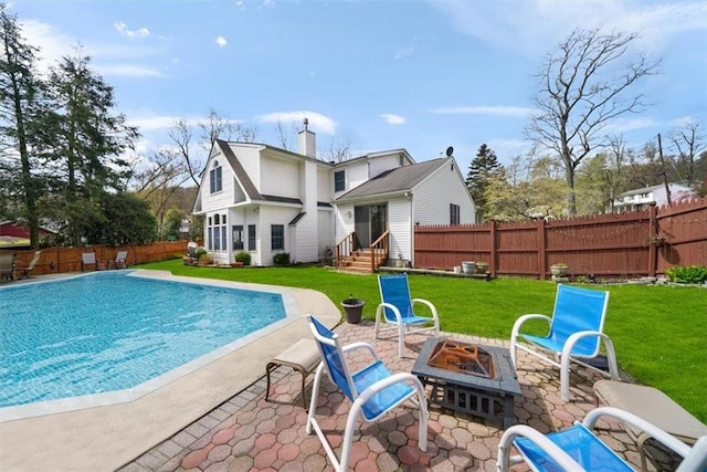 1 Cindy Ln, Highland Mills, NY 10930 - rear view of house with an outdoor fire pit, a fenced backyard, and a patio area