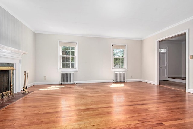 19 Cloverdale Ave, White Plains, NY 10603 - unfurnished living room featuring radiator heating unit, plenty of natural light, crown molding, and a fireplace