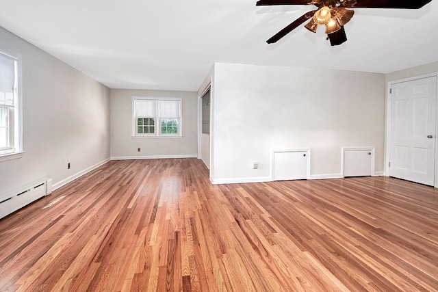 19 Cloverdale Ave, White Plains, NY 10603 - unfurnished living room featuring light wood-style flooring, ceiling fan, and a baseboard radiator