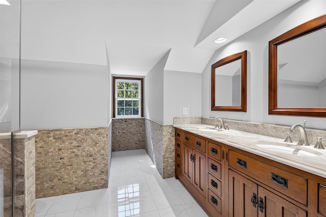 353 Split Rock Rd, Syosset, NY 11791 - bathroom with tile walls, wainscoting, double vanity, marble finish floors, and recessed lighting