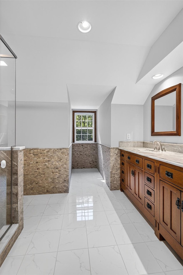 353 Split Rock Rd, Syosset, NY 11791 - full bathroom featuring a wainscoted wall, vanity, tile walls, marble finish floors, and a walk in shower
