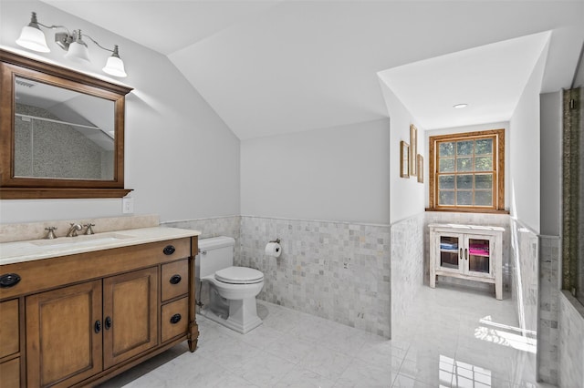 353 Split Rock Rd, Syosset, NY 11791 - bathroom with tile walls, vanity, wainscoting, vaulted ceiling, and a shower