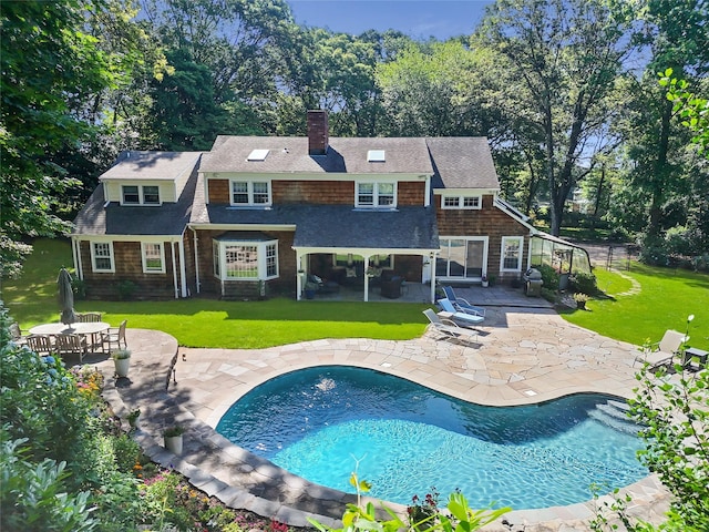 353 Split Rock Rd, Syosset, NY 11791 - rear view of house with a patio, a chimney, and an outdoor pool