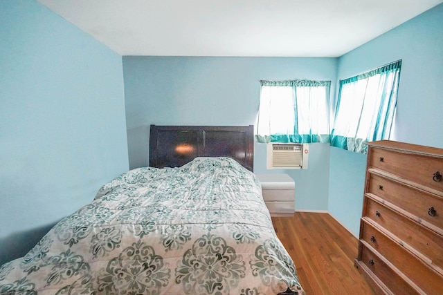 138 Fairview Ave, Deer Park, NY 11729 - bedroom featuring wood finished floors and cooling unit