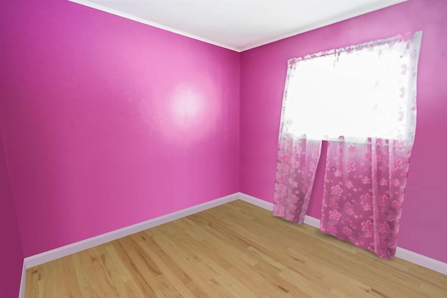 138 Fairview Ave, Deer Park, NY 11729 - empty room with wood finished floors and ornamental molding