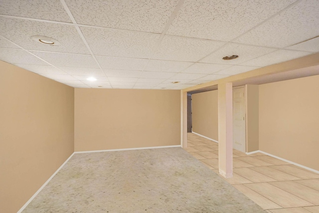 138 Fairview Ave, Deer Park, NY 11729 - finished below grade area with a paneled ceiling, recessed lighting, and light tile patterned floors