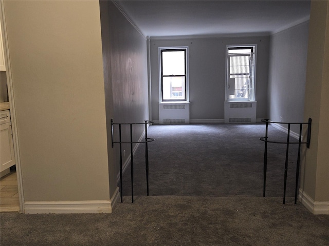 55 E 190th St Unit 45, Bronx, NY 10468 - empty room featuring carpet, radiator heating unit, and crown molding
