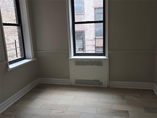 55 E 190th St Unit 45, Bronx, NY 10468 - empty room featuring radiator and baseboards