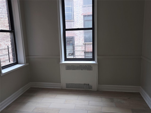 55 E 190th St Unit 45, Bronx, NY 10468 - spare room featuring radiator heating unit and baseboards