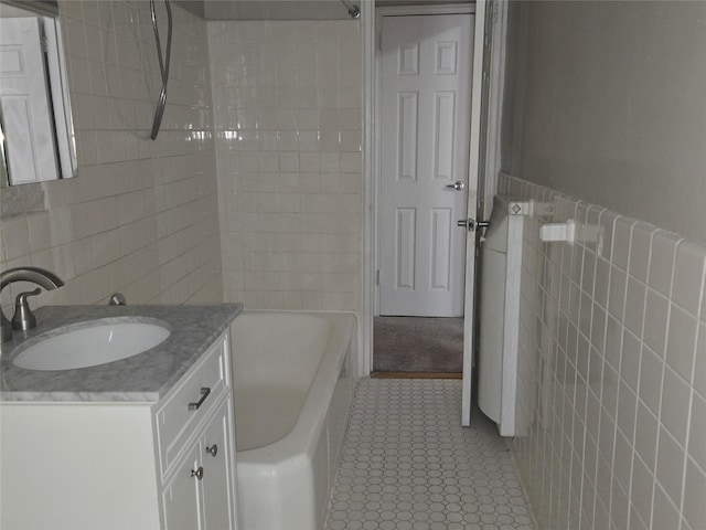55 E 190th St Unit 45, Bronx, NY 10468 - full bathroom featuring tile walls, vanity, tile patterned flooring, and bathtub / shower combination