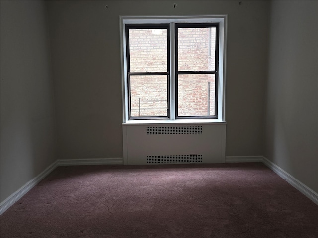 55 E 190th St Unit 45, Bronx, NY 10468 - carpeted spare room featuring radiator heating unit and baseboards