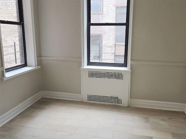 55 E 190th St Unit 45, Bronx, NY 10468 - spare room featuring radiator heating unit and baseboards
