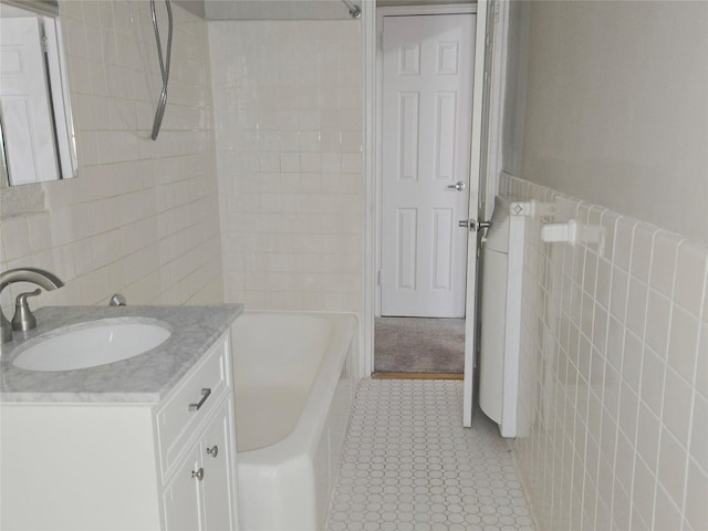 55 E 190th St Unit 45, Bronx, NY 10468 - bathroom with tile walls, vanity, tile patterned floors, and shower / bath combination