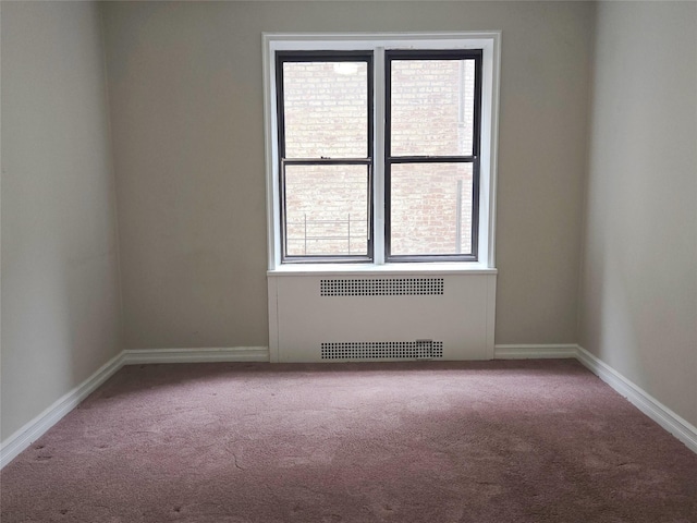 55 E 190th St Unit 45, Bronx, NY 10468 - carpeted empty room featuring radiator heating unit and baseboards