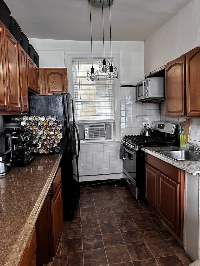 1836 Matthews Ave, Bronx, NY 10461 - kitchen with gas stove, stainless steel microwave, tasteful backsplash, a chandelier, and hanging light fixtures