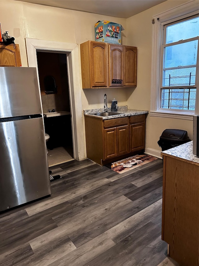 1836 Matthews Ave, Bronx, NY 10461 - kitchen with freestanding refrigerator, dark wood-style floors, brown cabinets, and light countertops